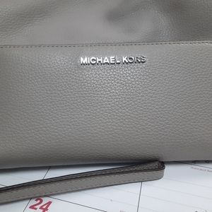 Michael Kors wallet, purse both gray.